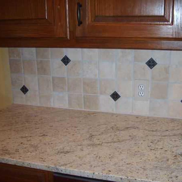 Tile backsplash with metallic accents from a bathroom remodeling project in Alpharetta GA